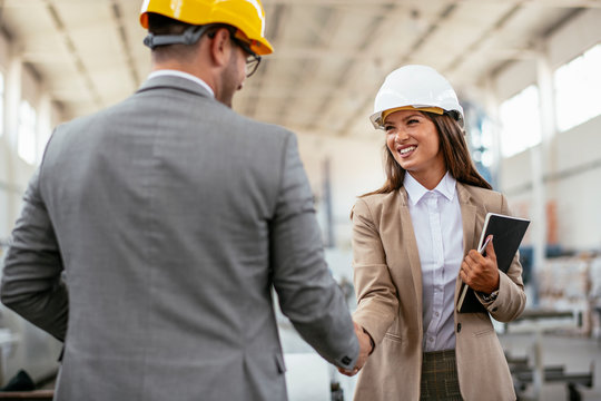 Businessman and businesswoman handshaking