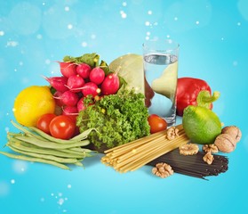 Fresh tasty vegetables with water on background