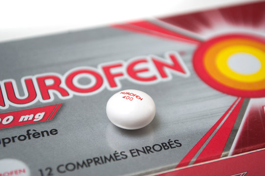 Mulhouse - France - 18 September 2019 - Closeup of nurofen pill on cardboard box background