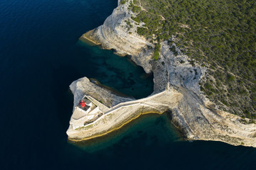 View from above, stunning aerial view of the lighthouse of Madonnetta at the entrance to the port...