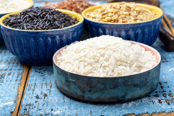 Different types of rice, white basmati, jasmine, arborio, brown and black