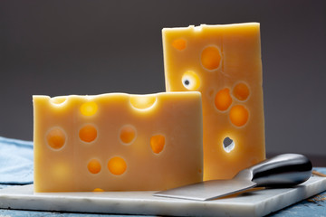 Two blocks of French emmental semi-hard cheese