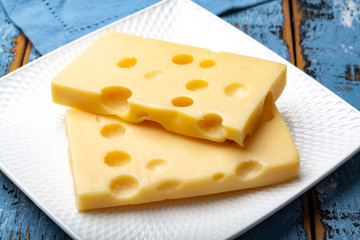 Two blocks of French emmental semi-hard cheese