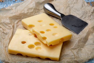 Two blocks of French emmental semi-hard cheese