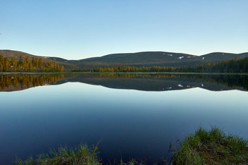 Mountains reflection to water