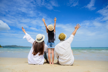 Group of happy family are enjoy trip of the sea beach together in vacation and long holidays