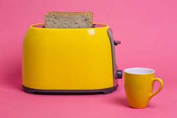 yellow toaster on a pink background 3