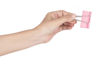 Hand holding Pink binder clips isolated on white background