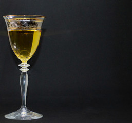 glass of wine on black background