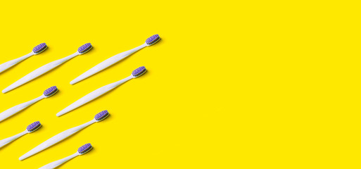 Toothbrush minimal pattern on yellow background.