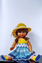 Old vintage doll in a beautiful outfit