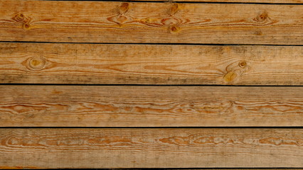 Fototapeta na wymiar Fence from the boards. Wood texture. Background for interior design.
