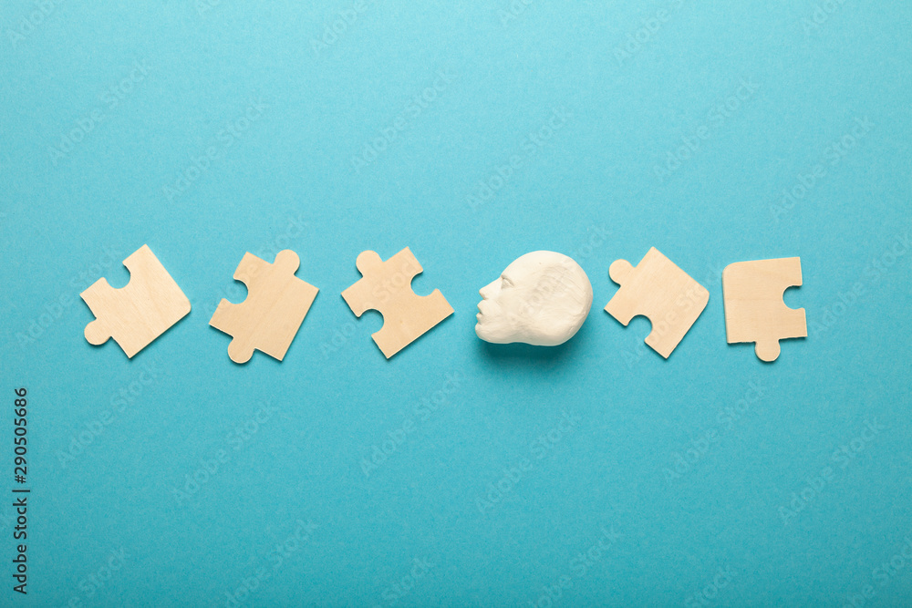 Poster puzzles around head. solution to mental problem. concept of creating idea.
