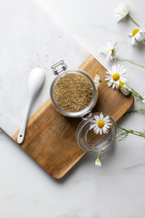 chamomile tea on marble background with copy space. Relax concept