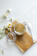 chamomile tea on marble background with copy space. Relax concept