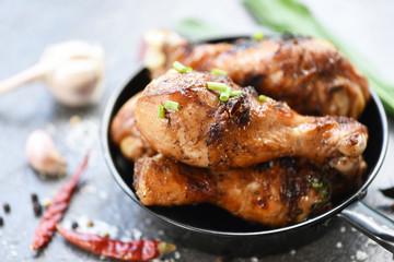 Grilled chicken legs barbecue with herbs and spices - Tasty chicken legs on the pan with ingredients cooking food