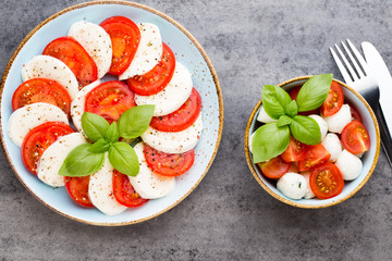 Classic caprese salad. Mozzarella tomatoes and  Basilikum.