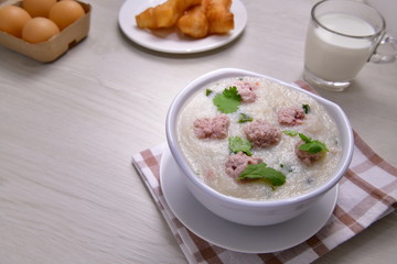 Minced pork congee, Breakfast for asian  providing hot deliciousness, using deep-fried doughstick and milk.