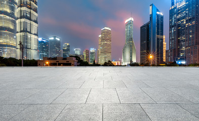 Shanghai commercial center building scenery and empty square floor at night,China.