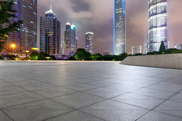 Shanghai commercial center building scenery and empty square floor at night,China.