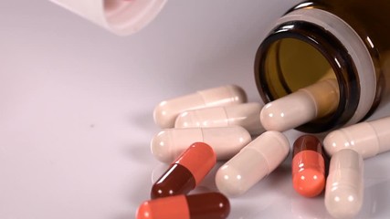 Pharmaceutical industry drugs pills vitamins slow motion