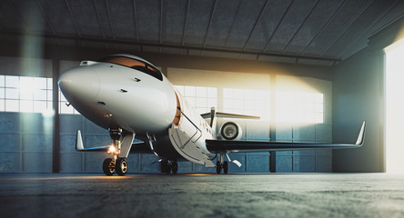 Business private jet airplane parked at maintenance hangar and ready for take off. Luxury tourism and business travel transportation concept. 3d rendering