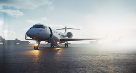 Corporate business class jet airplane parked at airfield and waiting vip persons for take off. Luxury tourism and business travel transportation concept. 3d rendering