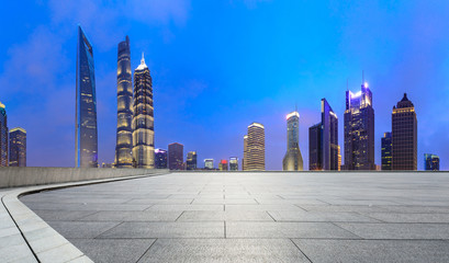 Shanghai commercial center building scenery and empty square floor at night,China.