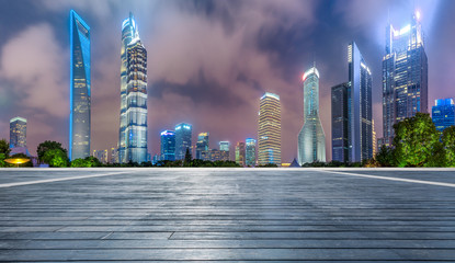 Shanghai commercial center building scenery and wooden board square at night,China.