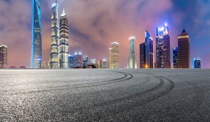 Race track ground and modern commercial buildings in Shanghai at night,China.