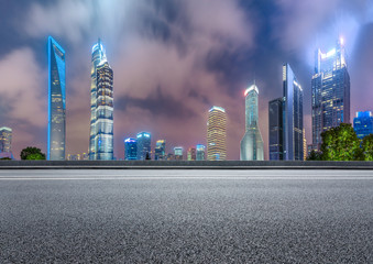 Obraz premium Shanghai modern commercial buildings and asphalt highway at night,China.