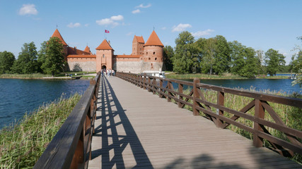 Naklejka premium The famous Trakai Island Castle in Lithuania in a blue sky day and calm lake