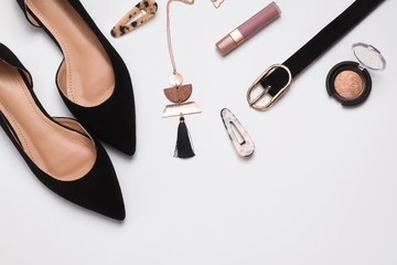 Stylish feminine accessories isolated on white background.