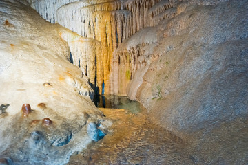 Ancient cave with stalactites and stalagmites