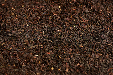 The texture of black dry tea.