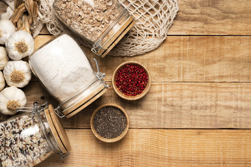 Healthy food and seeds on wooden background with copy space