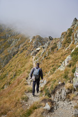 Fototapeta premium Man with backpack hiking
