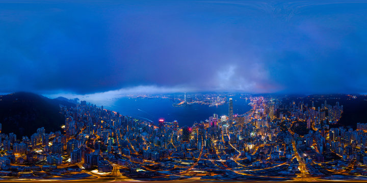 360 panorama by 180 degrees angle seamless panorama view of aerial view of Hong Kong Downtown. Financial district and business centers in technology smart city. skyscraper and buildings at night.
