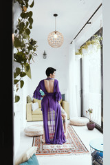 female with short haircut poses in Tbilisi loft