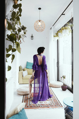 female with short haircut poses in Tbilisi loft