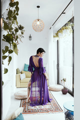 female with short haircut poses in Tbilisi loft
