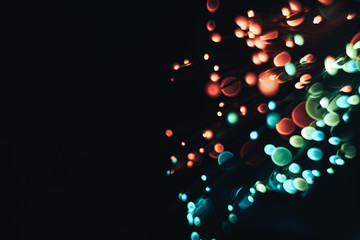 Beautiful multi colored  abstract optical light bokeh on a dark background.