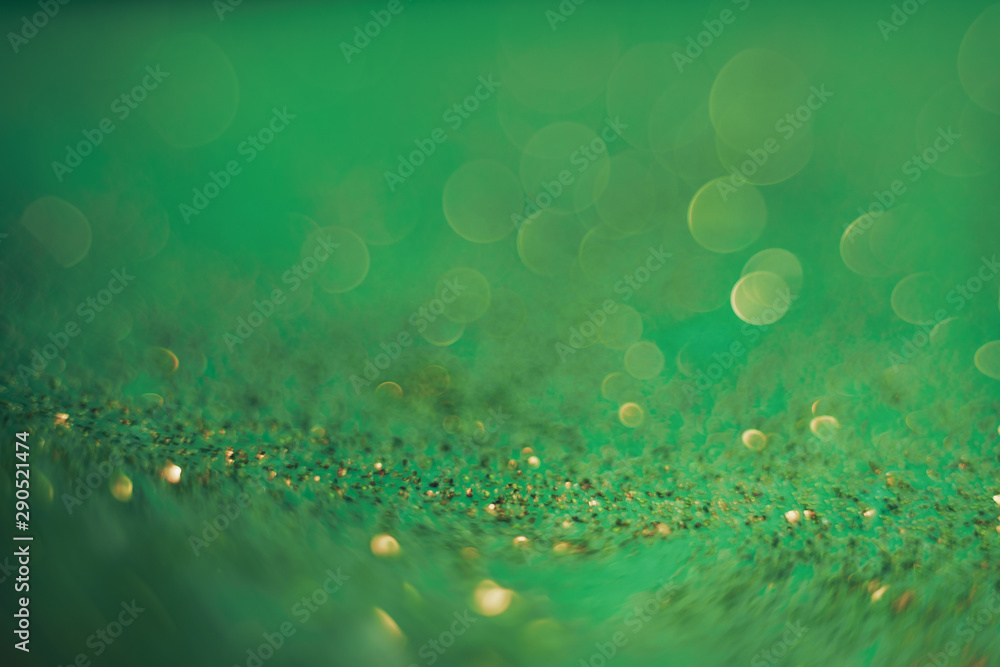Poster Beautiful abstact  light bokeh on a green background.