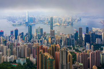Aerial top view of Hong Kong Downtown, republic of china. Financial district and business centers in smart urban city in Asia. Skyscrapers and high-rise modern buildings at sunset. - obrazy, fototapety, plakaty