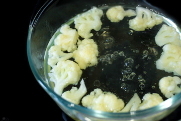 Quickly prepare the cauliflower. Dietary, proper, baby food concept.