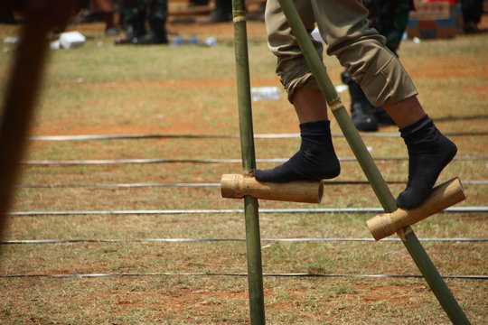 Batang, Central Java / Indonesia - September 16 2019 : Play egrang, a traditional game from Indonesia.