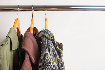 Set of woman's outwear for autumn and winter season on hangers