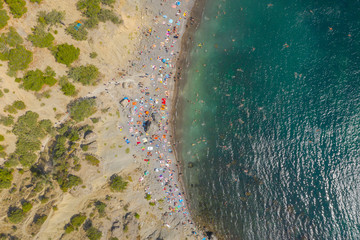 Aerial view of crowded colorful paradise beach on Black Sea, Crimea