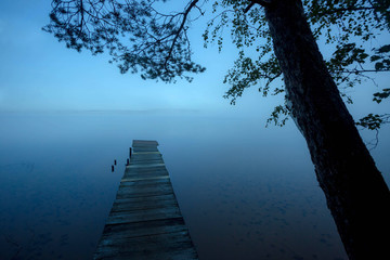 a lonely old pier on the lake. North of Leningrad region. Russia