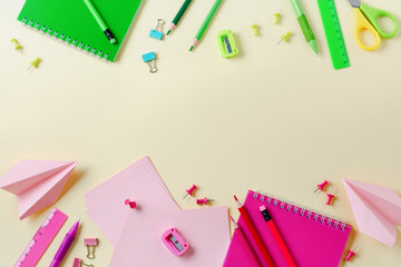 Notebook, colored pencils, ruler, pen, eraser, sharpener and more. School and office stationery on yellow background. Concept back to school. Top view.